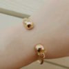night frights dual skull cuff bracelet rose gold on female wrist